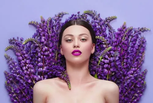 purple woman visualizing future on a bed of lavendar