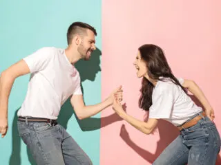 girl learned how to manifest her ex back and they are on a pink and blue background happy together playing games. how to manifest your ex back.