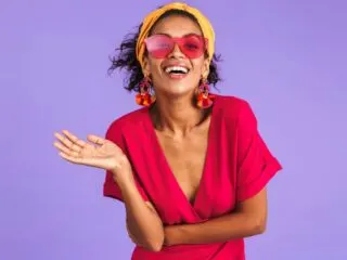 happy woman with positive intentions on a purple background
