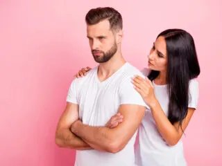 Portrait of his he her she two nice attractive lovely sullen spouses folded arms wife supporting husband family difficulties grief isolated over pink pastel background bad karma.